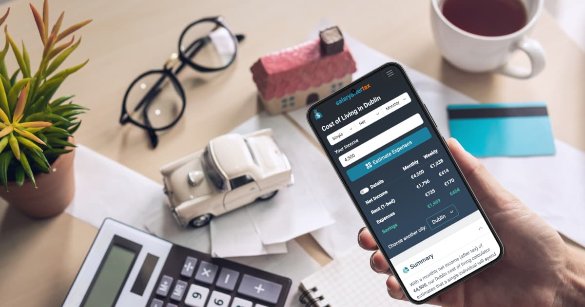 Person diligently checking one of the SalaryAfterTax cost of living calculators on their mobile phone
